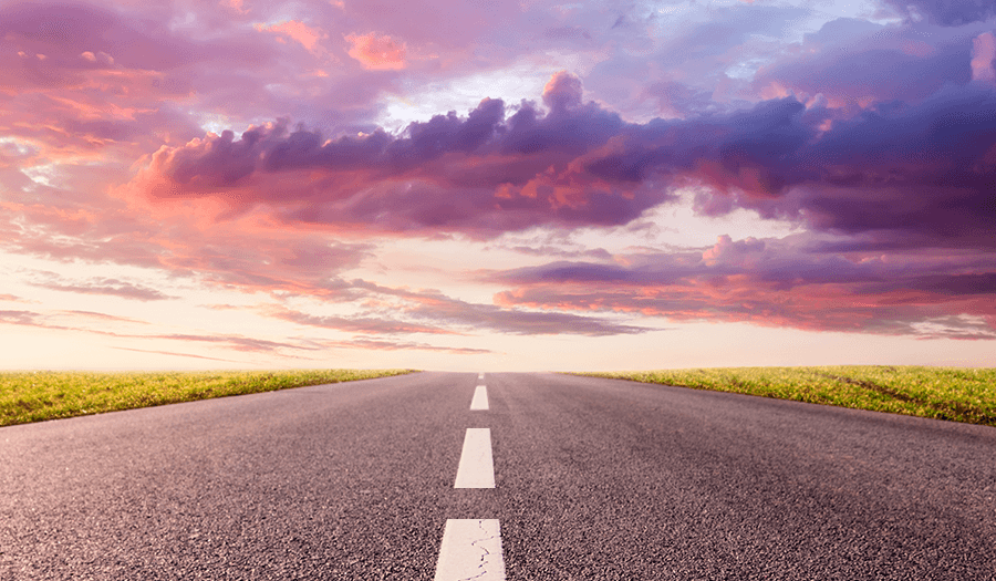 A picture of a road in the direction of a sunrise representing a hopeful journey for eclosing