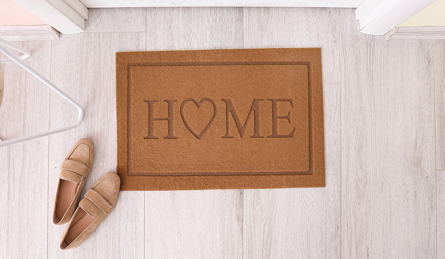 Photo of a 'welcome home' mat